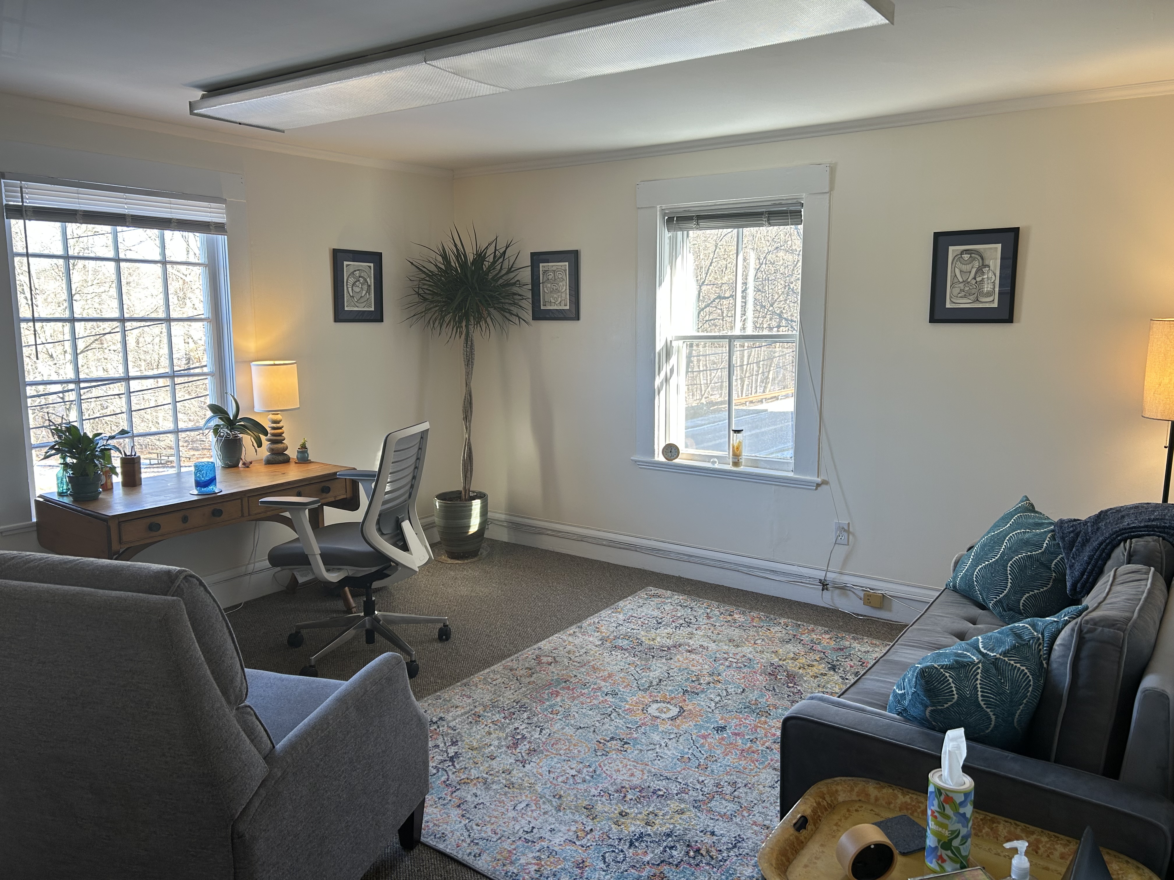 Welcoming therapy office with comfortable chairs and warm lighting